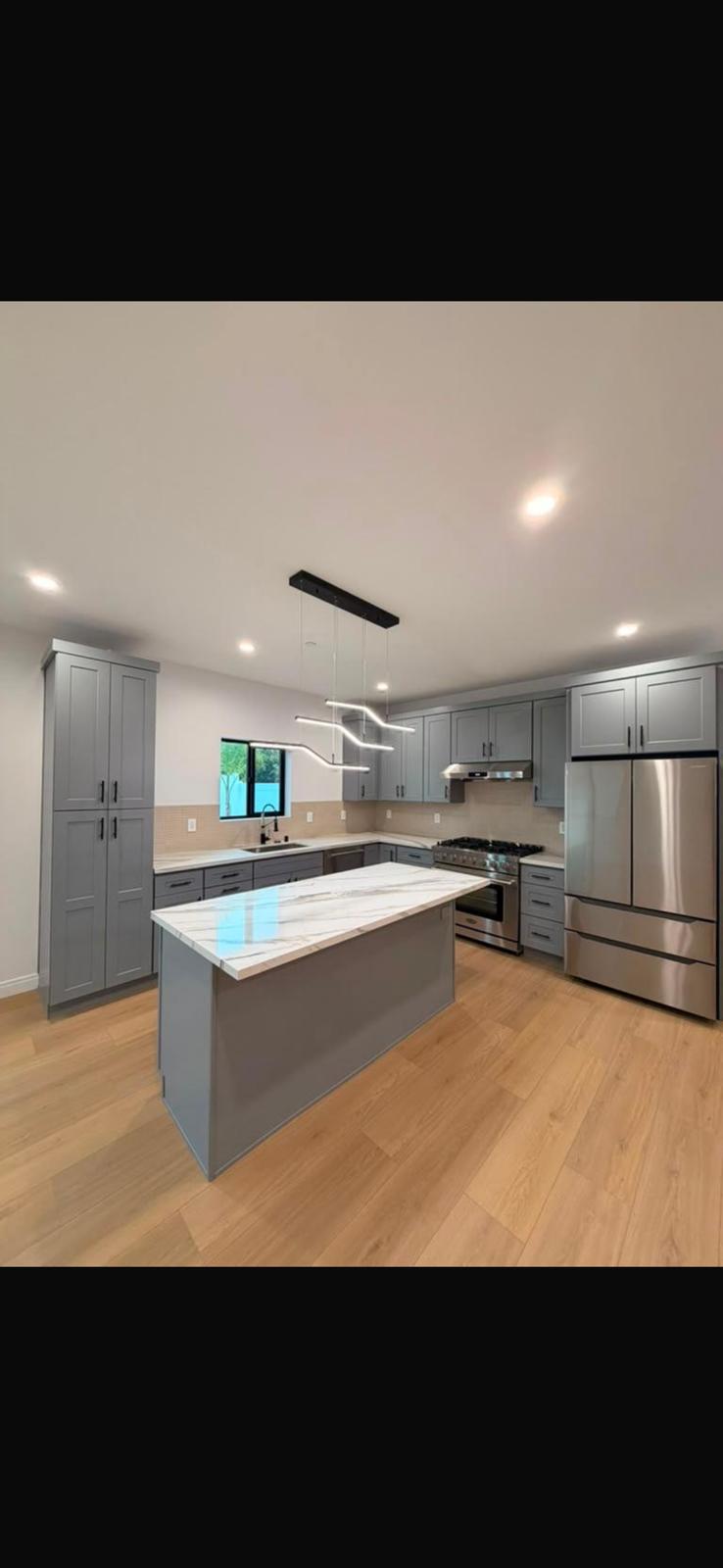 Modern grey kitchen with marble island