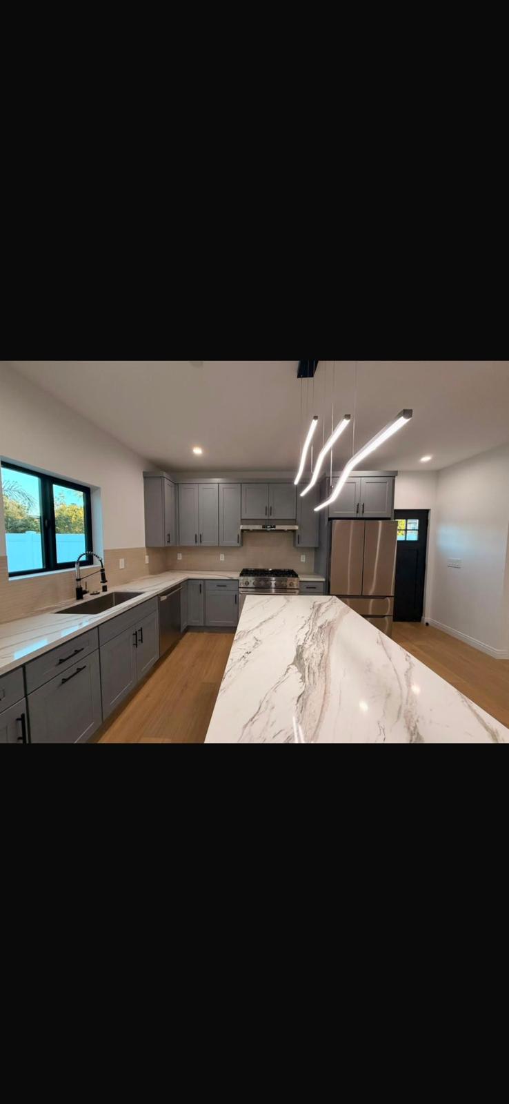 Marble waterfall kitchen island
