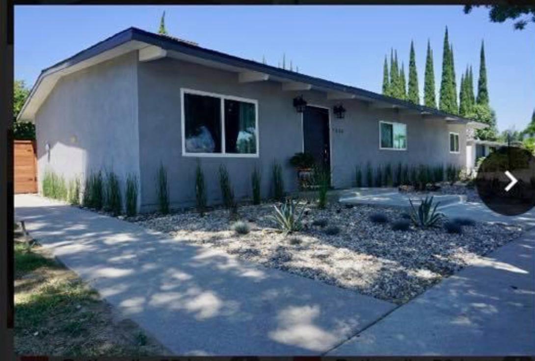 Grey stucco home with desert landscaping